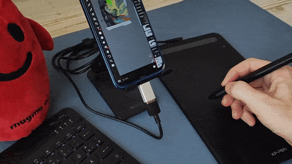 Using a drawing tablet connected to a smartphone to draw in Magma.